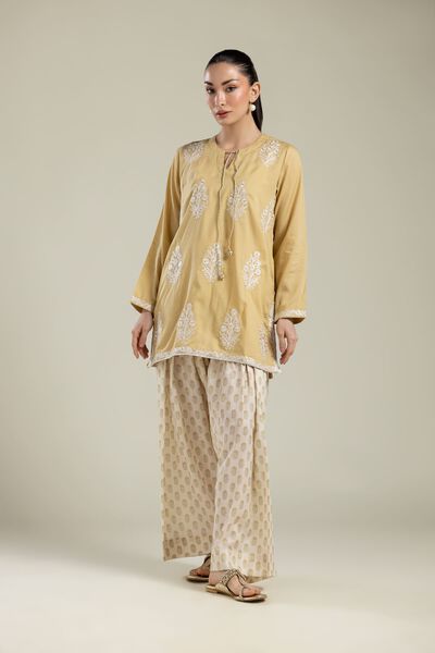 Embroidered | Textured Weave | Beige Printed Pants | AED 100.00